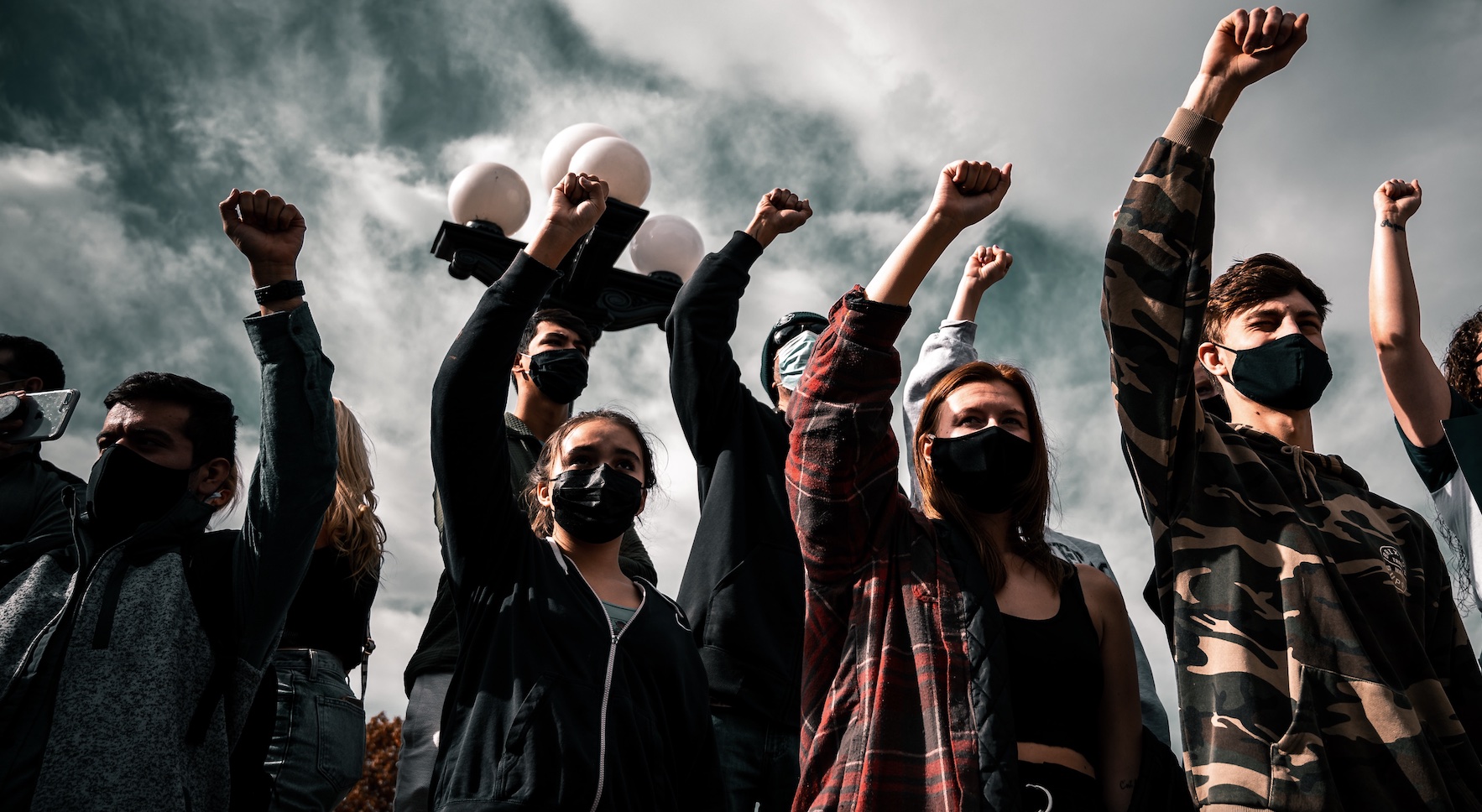 Group of people with raised fists.