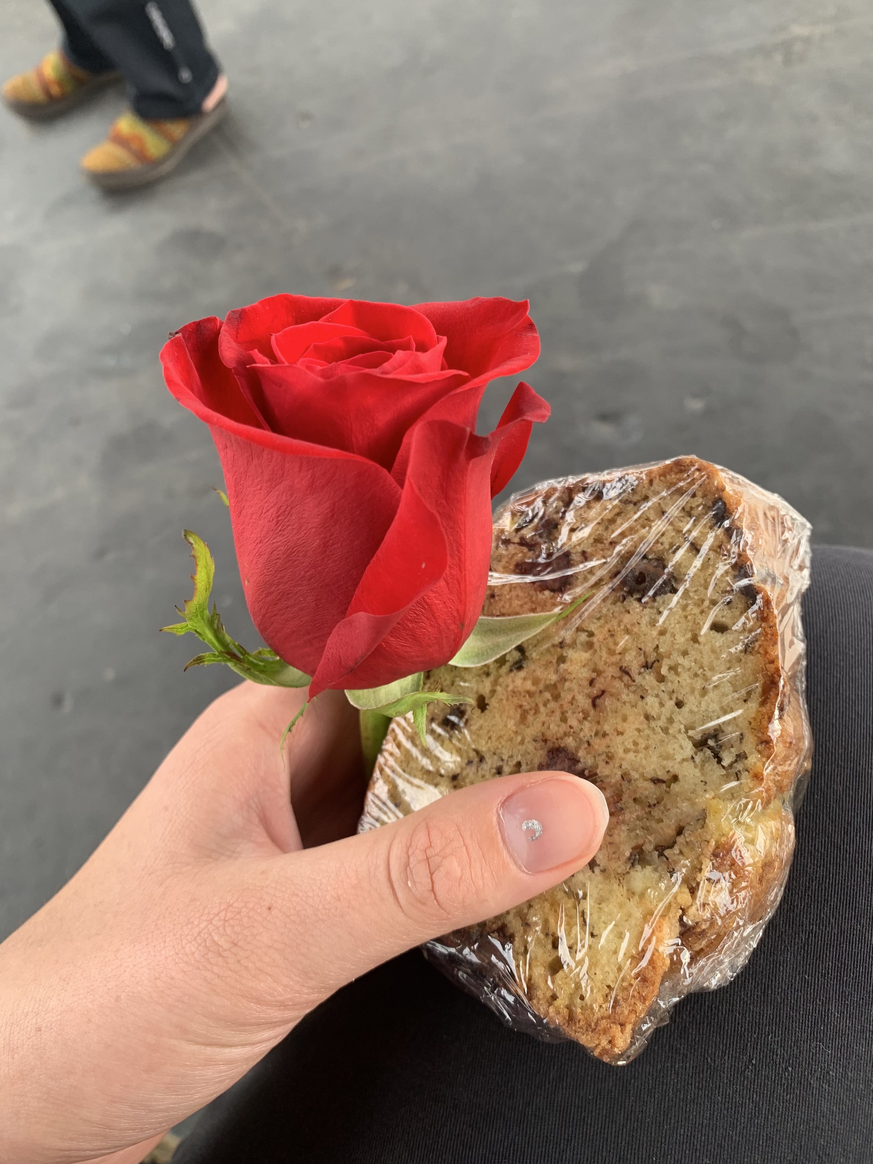 Red rose and a slice of banana bread.