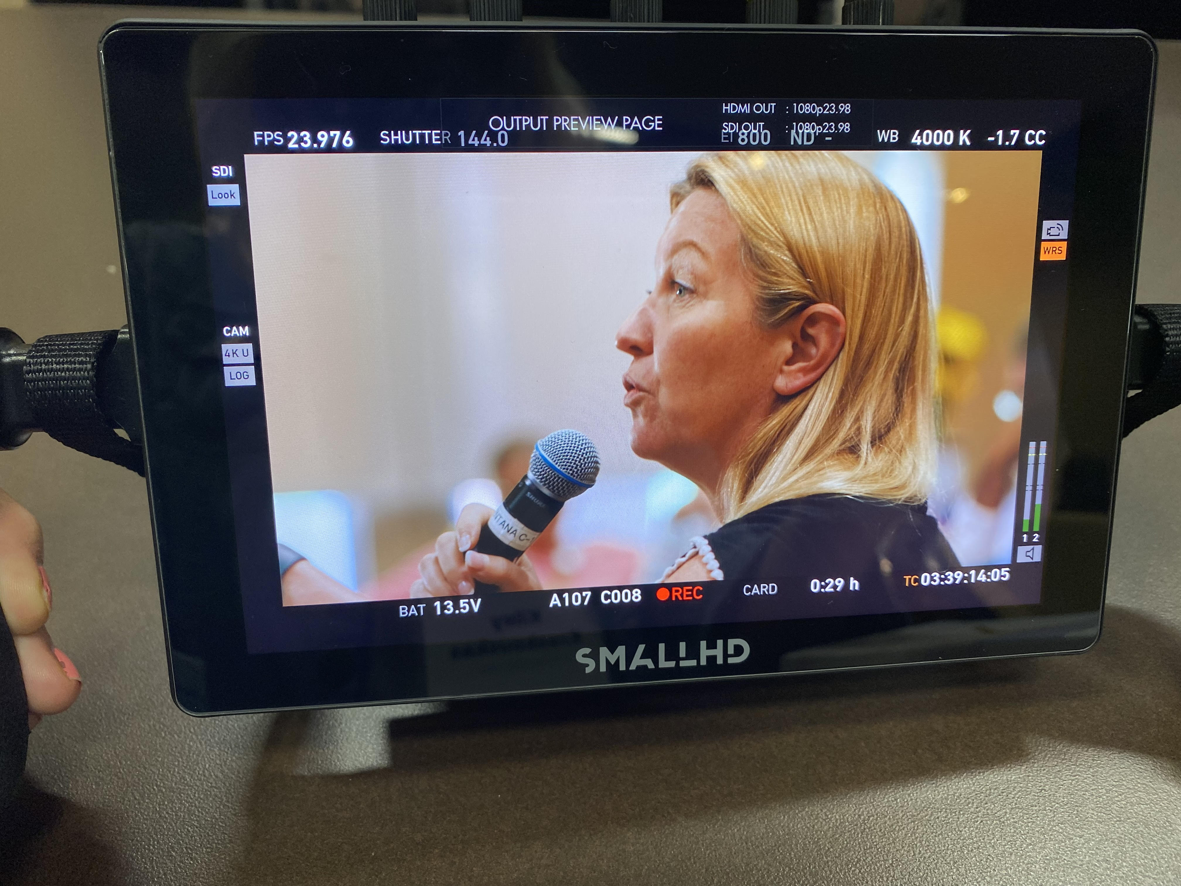 LaDawn speaking into a microphone.