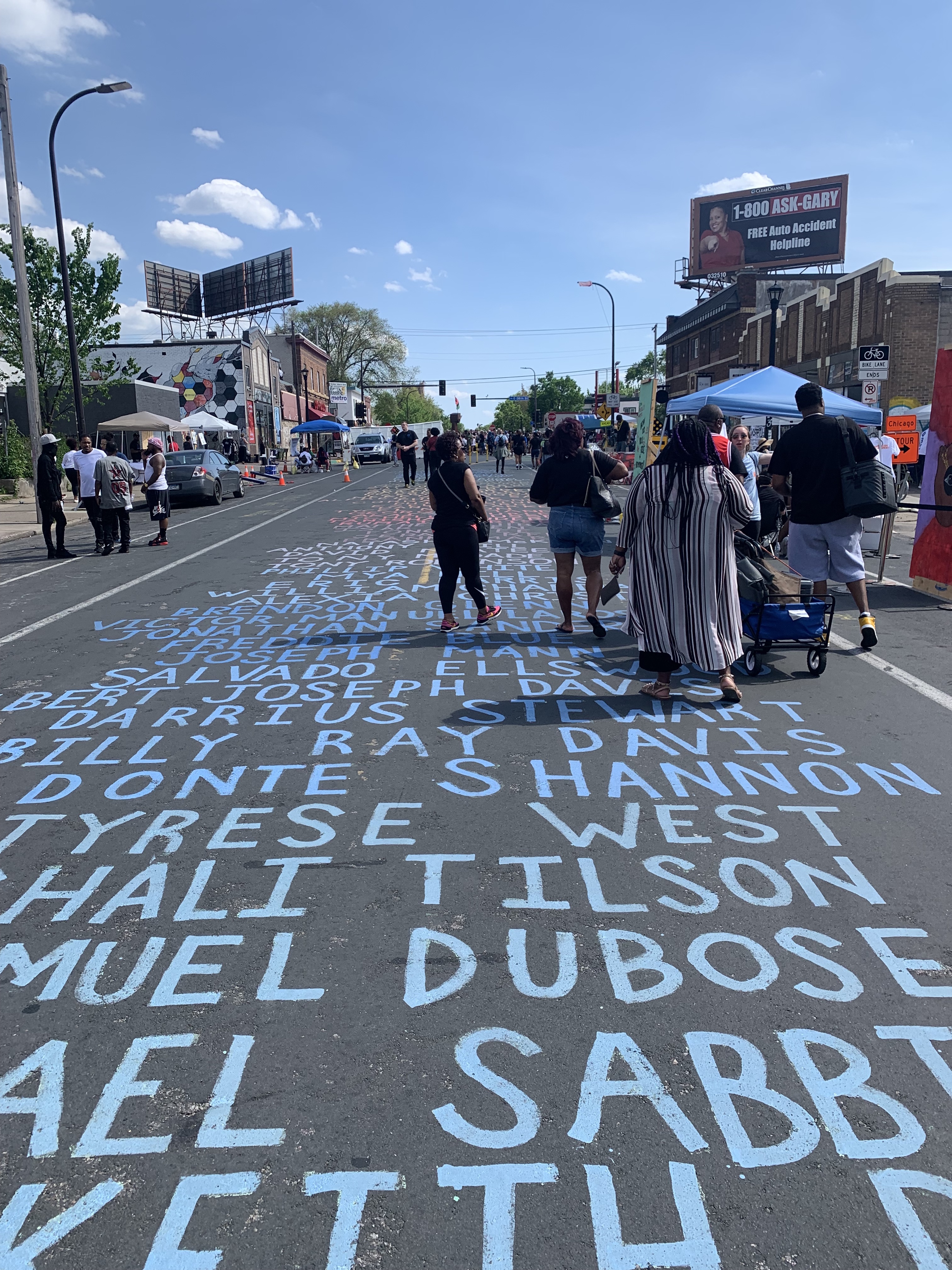Image of a street with names painted on it.