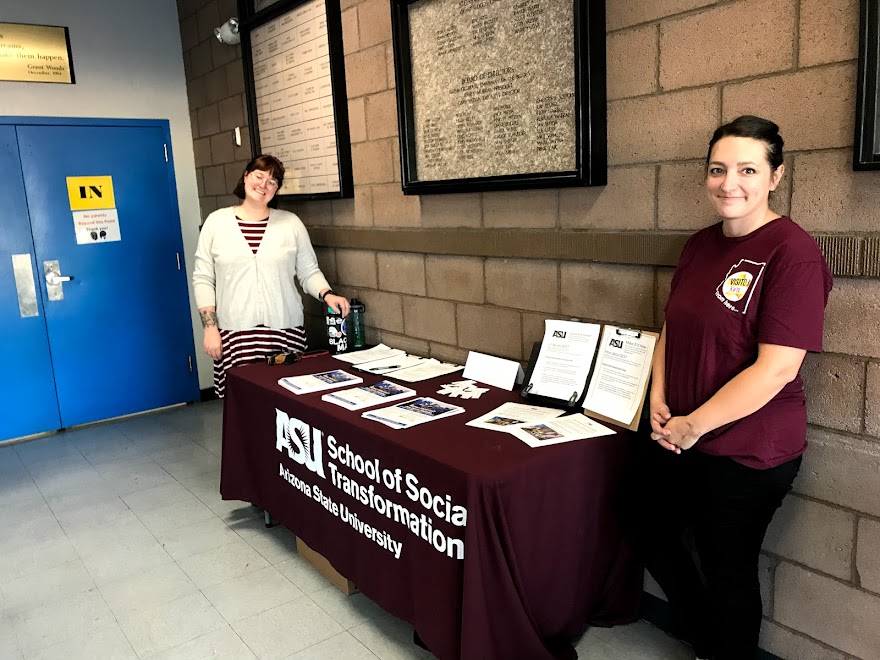 Two people sitting at a CCI table.
