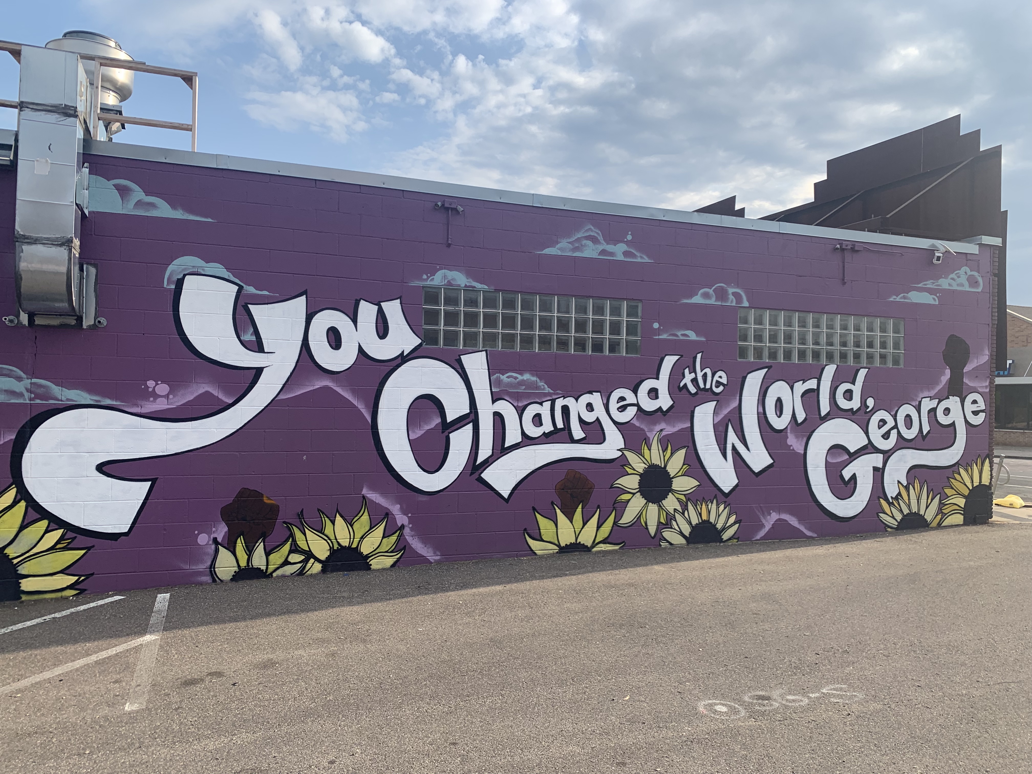 Mural reads: "You changed the world, George"