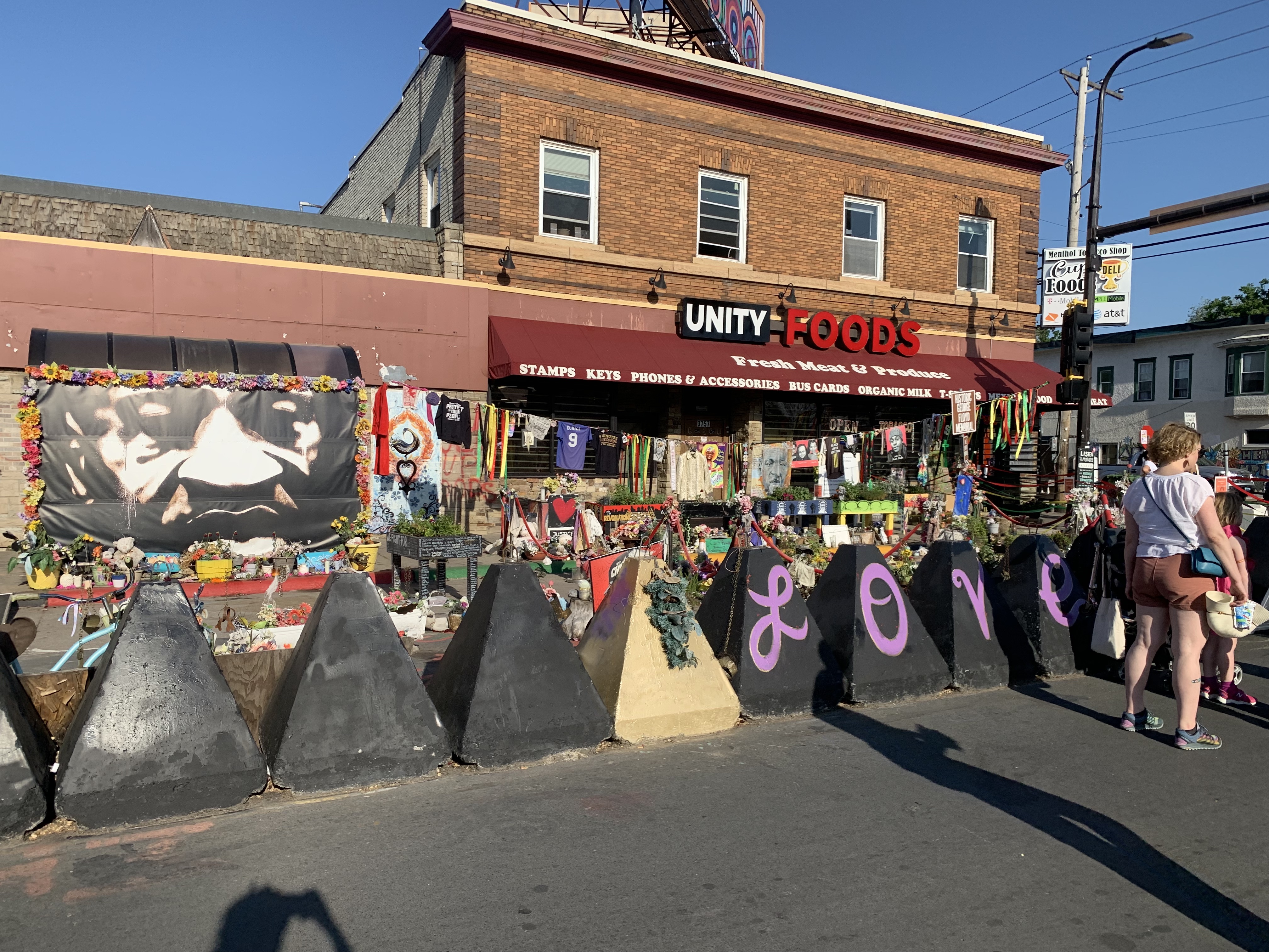 A memorial reads "love."