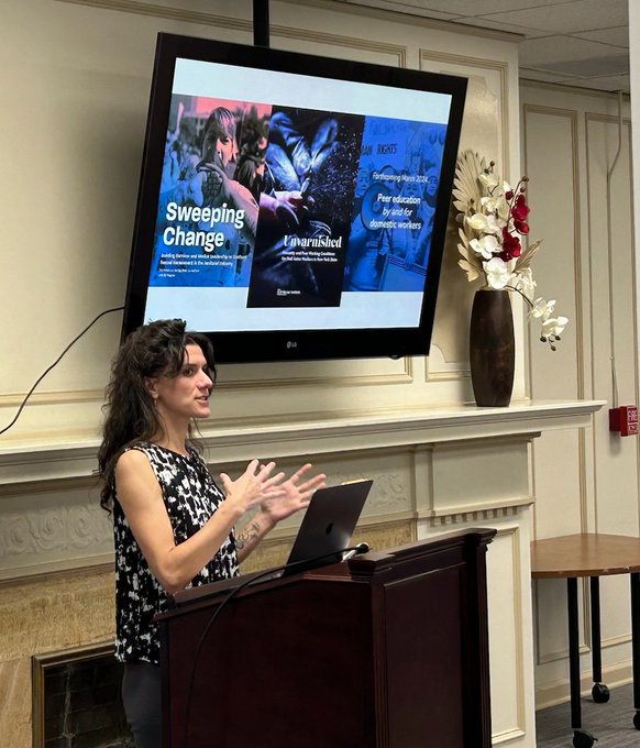 Woman speaking at a podium