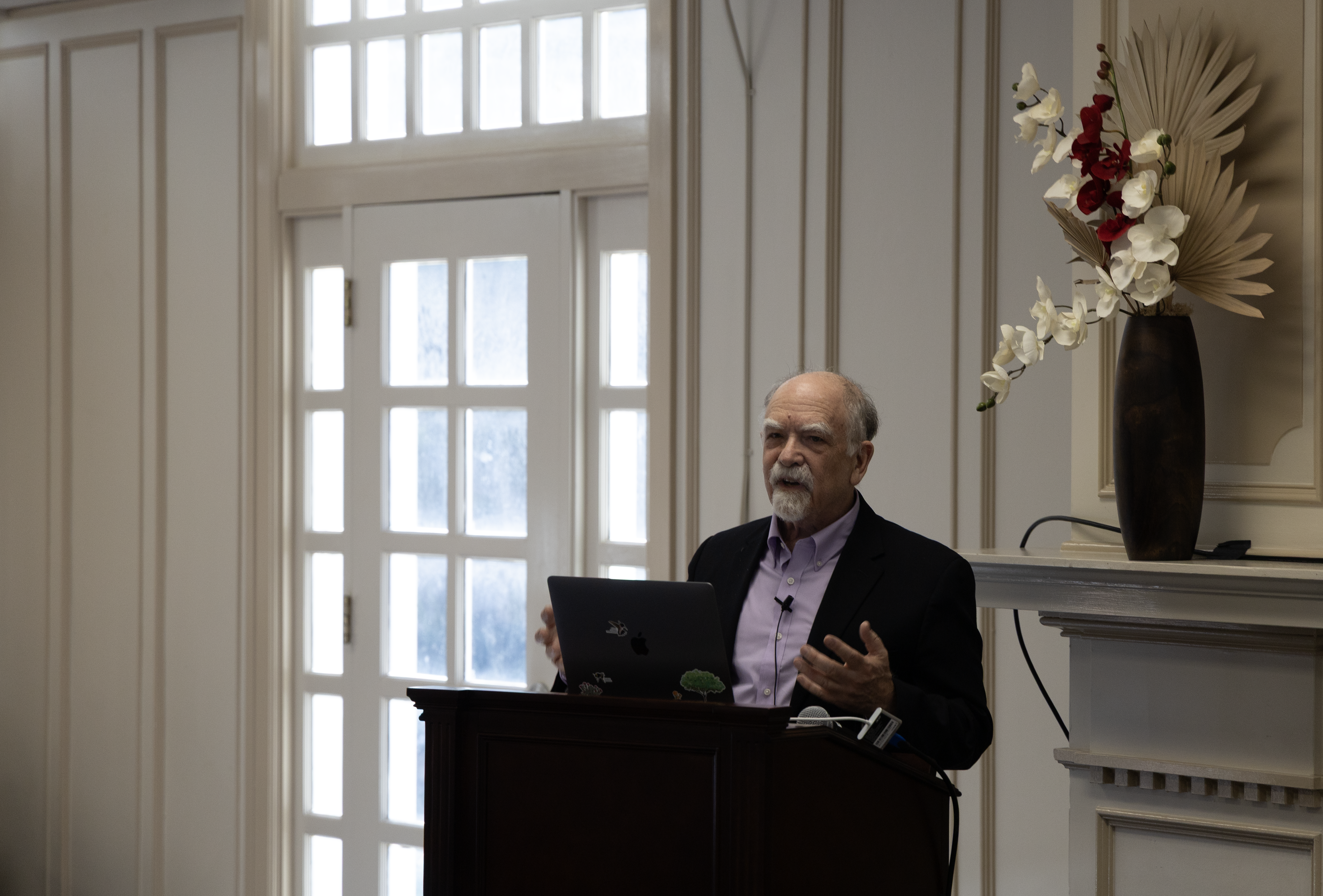 Fred Block speaks behind podium at event.
