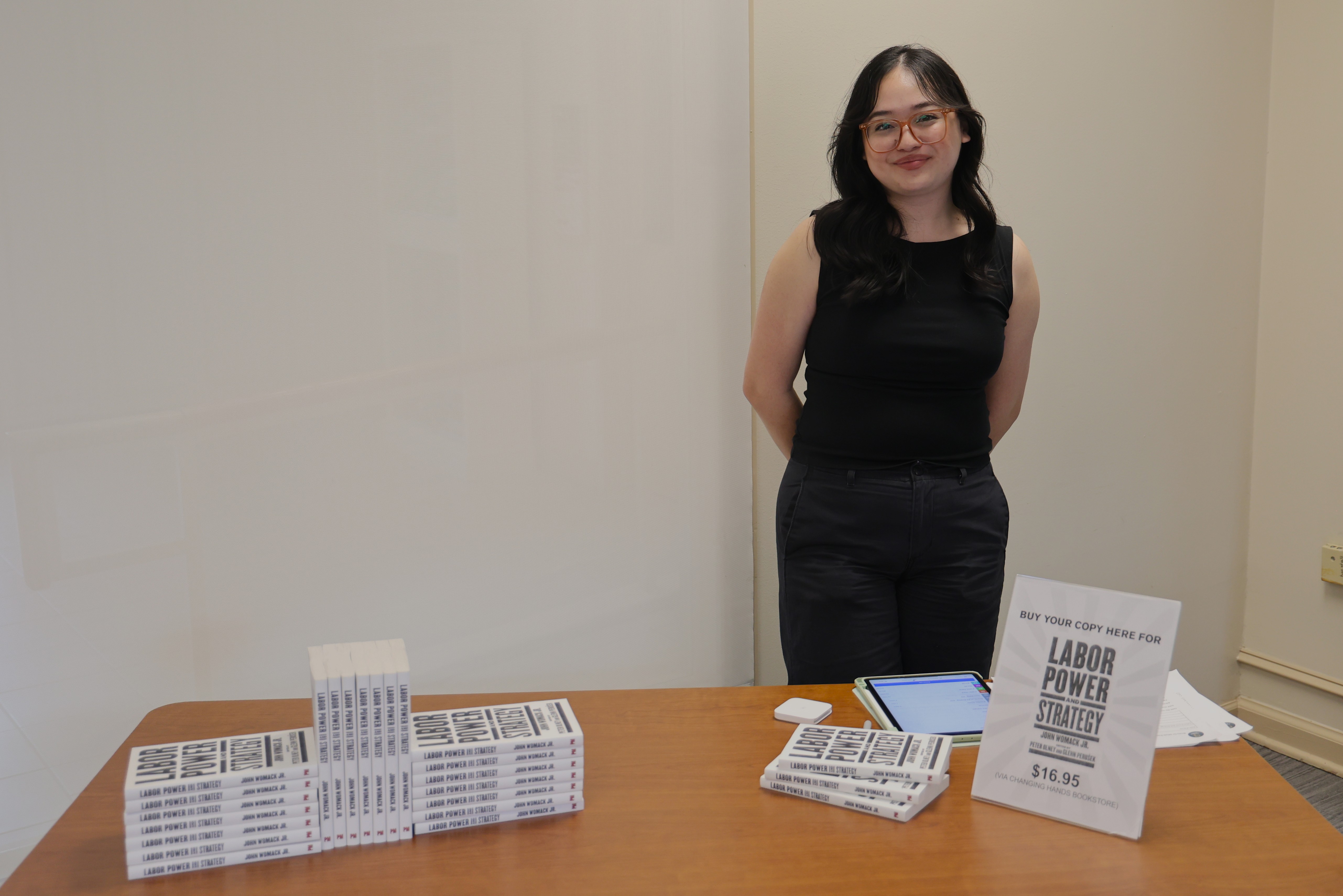 Kayla Le selling John Womack's book