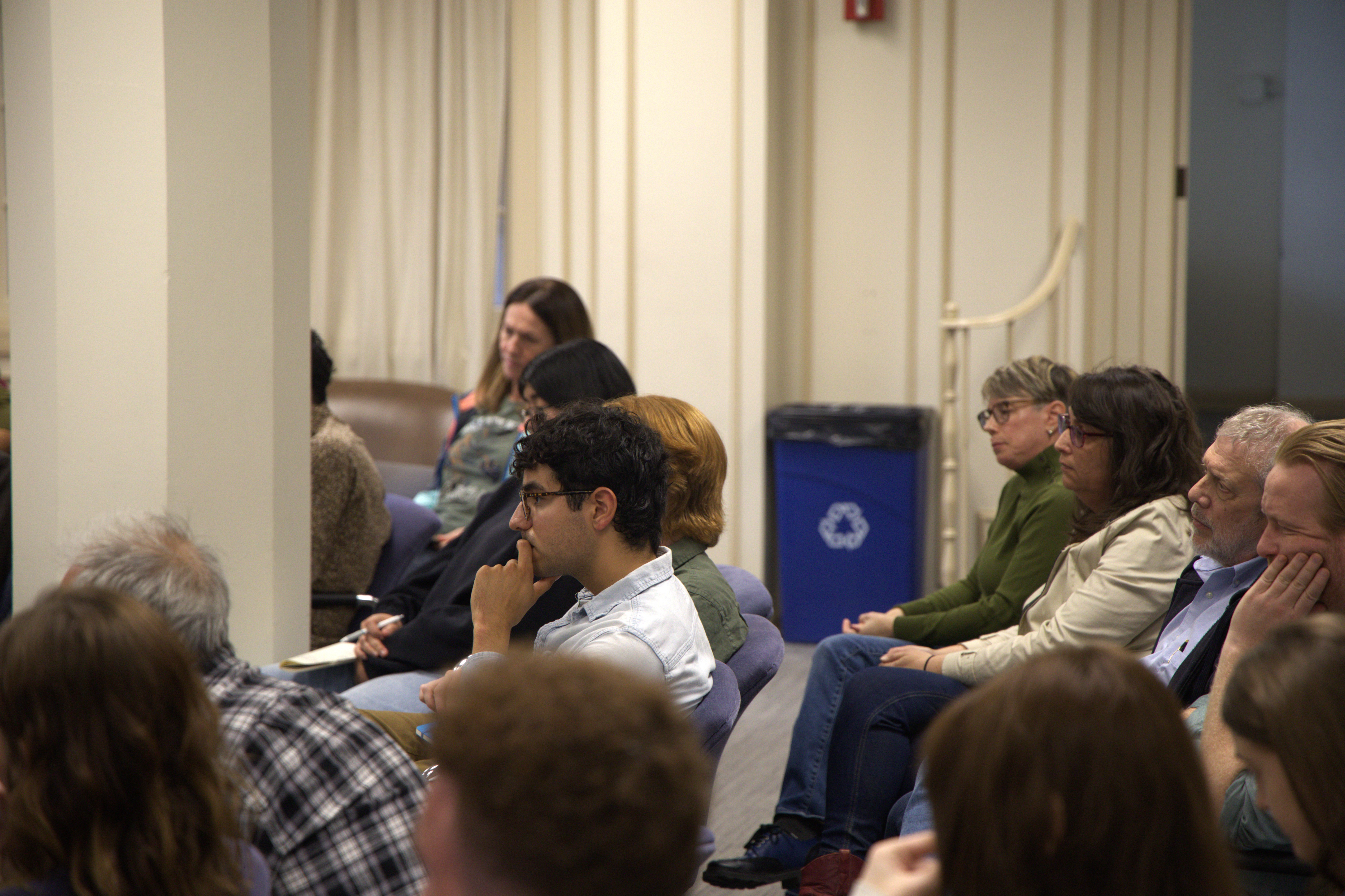 Audience listening intently to John Womack.